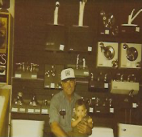 Joe Santangelo and his son at the shop